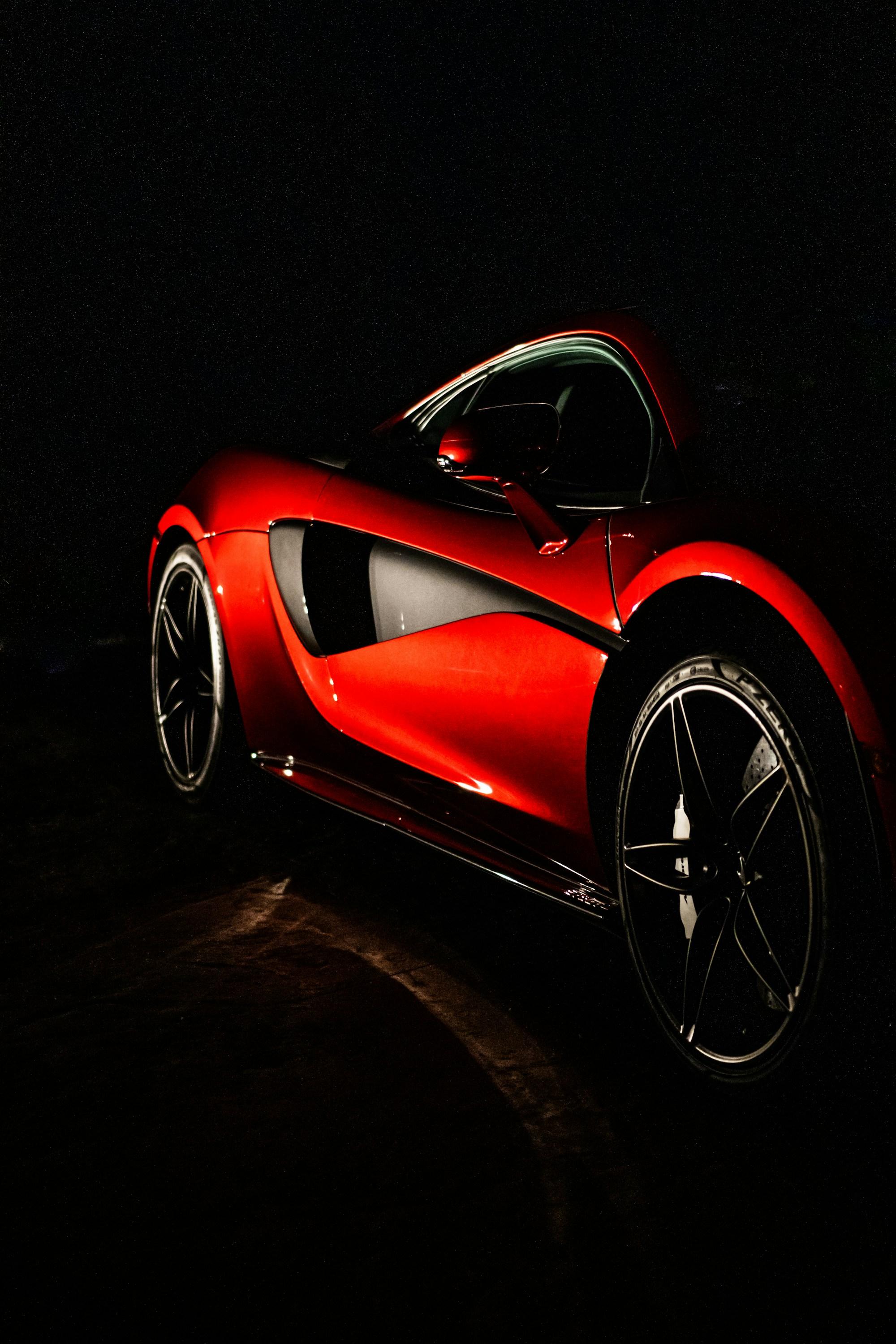 A performance exotic car under dramatic low light