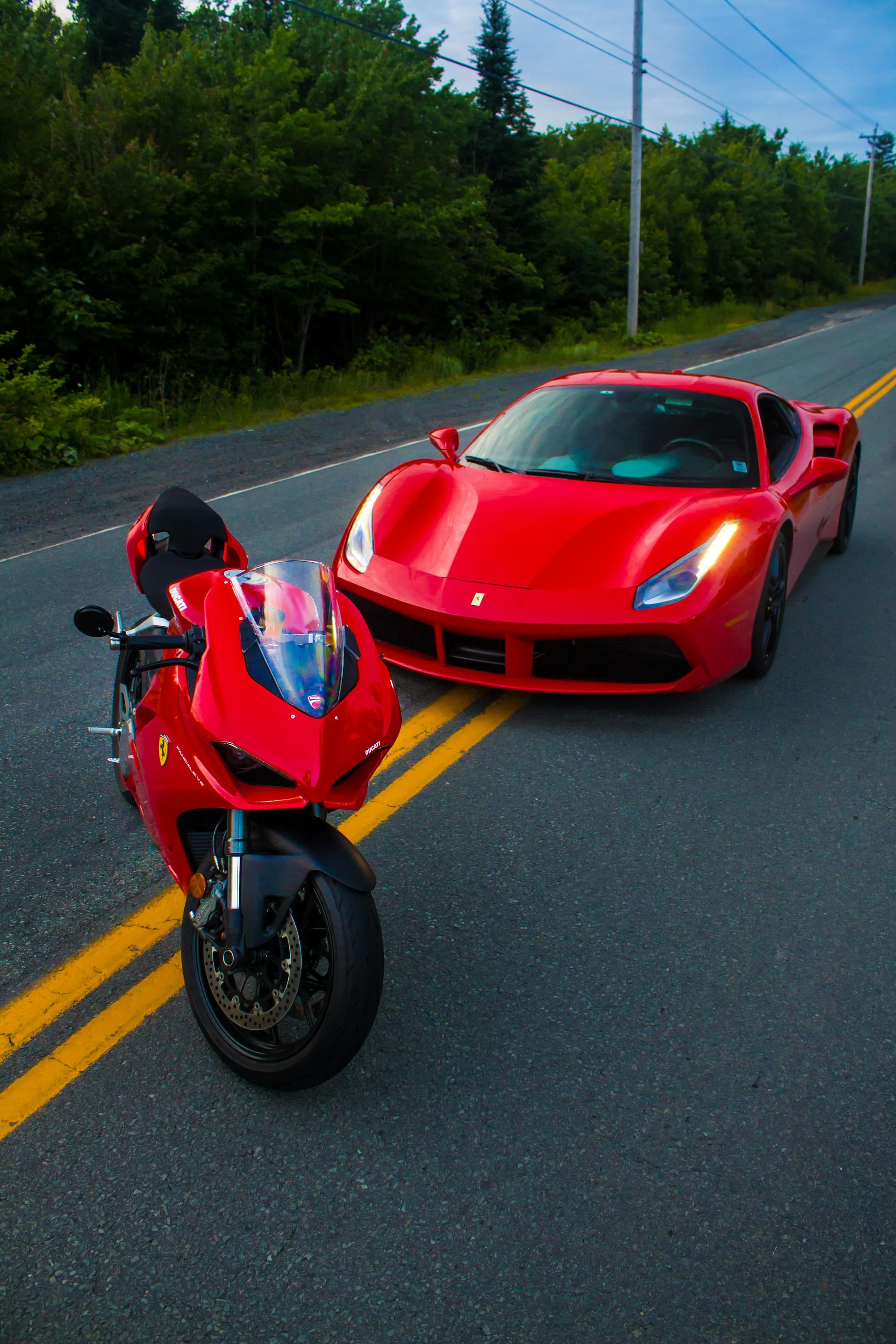 A supercar and a sports motorcycle on the open road